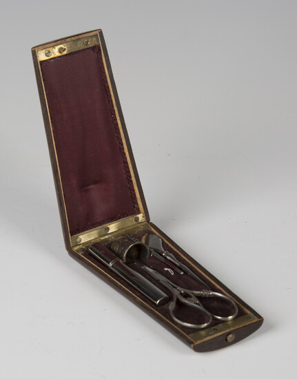 A 19th century French walnut and boxwood inlaid étui, the hinged lid enclosing a fitted interio