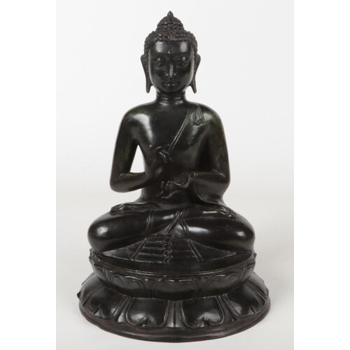 A 19th century Sino-Tibetan cast metal statue of a seated Bu...