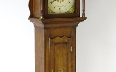 A 19thC oak cased 8-day longcase clock. The painted arch dial signed Foster Guildford. The case
