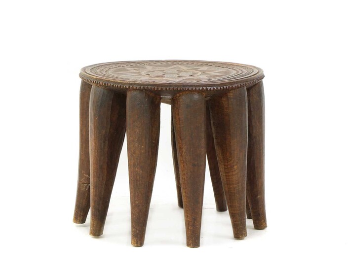 A 20th century African hardwood circular occasional table