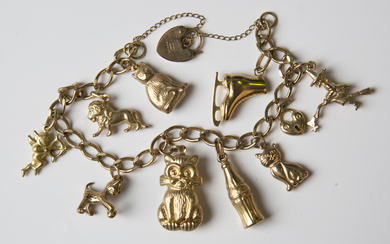 A 9ct gold curblink charm bracelet, fitted with nine 9ct gold charms, including a lion, four cats an