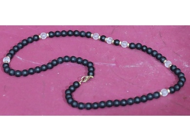 A 9ct gold onyx and rock crystal bead necklace, 48cm long.