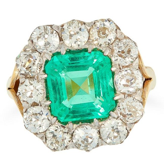 A COLOMBIAN EMERALD AND DIAMOND CLUSTER RING set with