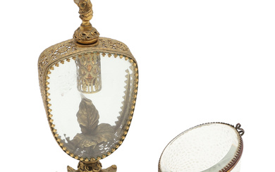 A CONTINENTAL GILT METAL AND GLASS PERFUME BOTTLE.