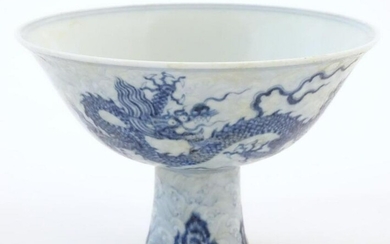 A Chinese blue and white dragon stem bowl with a raised