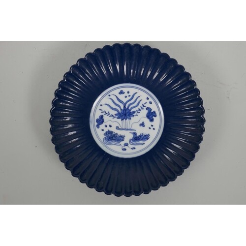 A Chinese blue and white porcelain Ming style ribbed dish wi...