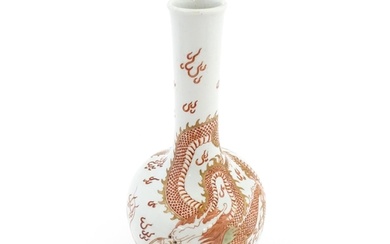 A Chinese bottle vase decorated with a dragon, flaming pearl...
