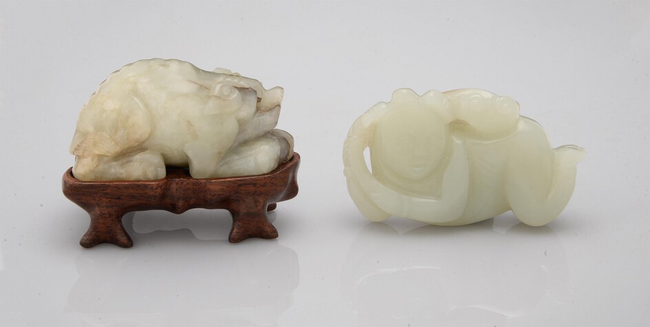 A Chinese celadon and russet jade 'Boy and fungus' carving
