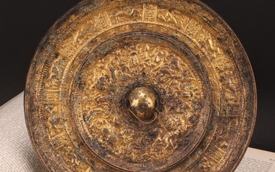 A Chinese gilt bronze mirror, cast in the Archaic taste, 21....