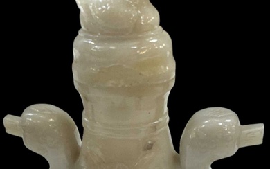 A Chinese jadeite twin handled lidded vase with carved figural...