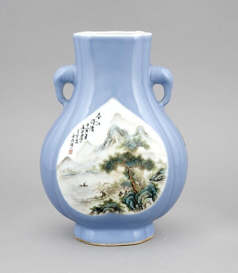 A Chinese vase, late Qing /early republic period, porcelain, polychrome onglaze painting, flattened pear shape on a high stand, 2 stylized elephant-head handles, the light blue background with landscape painting, inscription in black, iron-red seals...