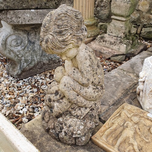 A Composite stone garden fountain head in the from of a chil...