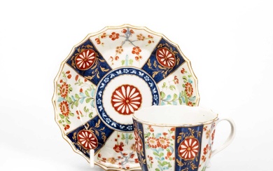 A FACTORY DECORATED WORCESTER CUP AND SAUCER, CIRCA 1770