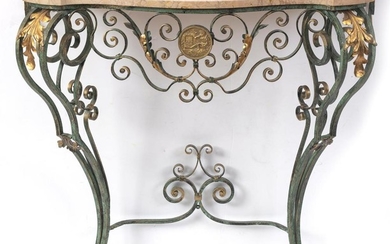 A FRENCH WROUGHT IRON CONSOLE TABLE OF SERPENTINE FORM, THE BASE PAINTED GREEN WITH GILDED HIGHLIGHTS AND APPLIED WITH A BRASS PLAQU...