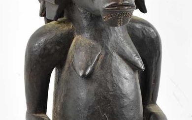 A Fang, Gabon figure with carved coiffeur and brass stud...