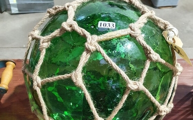 A GREEN GLASS FLOAT BALL