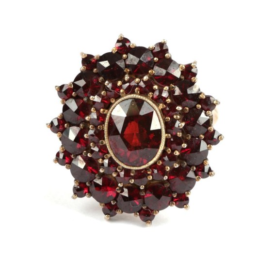A Garnet Cluster Ring, with three rows of rose cut...