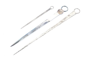 A George III silver ring-handled meat skewer and two later examples.