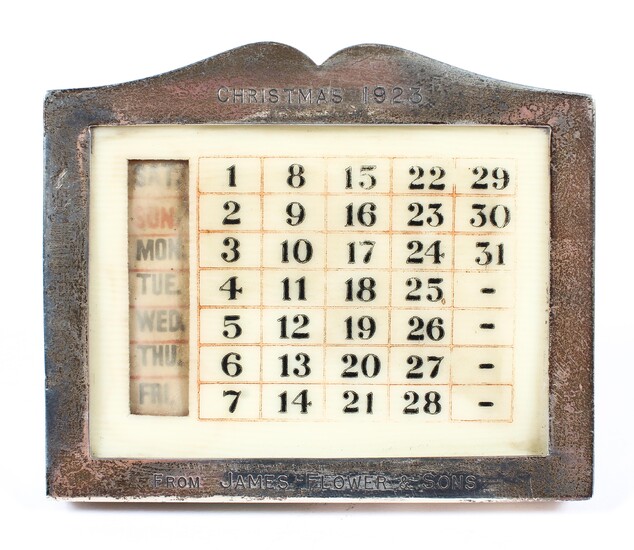 A George V silver mounted desk calendar of rectangular form