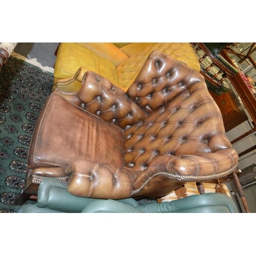 A Georgian style leather button upholstered and brass studde...