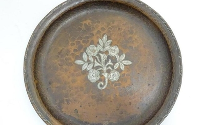 A Hugh Wallis Arts and Crafts hammered copper charger