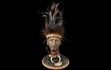 A MODEL OF A TRIBAL ELDERS' HEAD A NEW GUINEA TRIBAL HEAD UNDER A LARGE 19TH CENTURY GLASS DOME