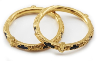 A PAIR OF ANTIQUE GOLD AND BLACK CORAL BANGLES