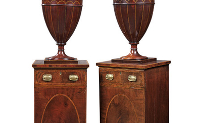 A PAIR OF DINING-ROOM PEDESTALS, GEORGE III, CIRCA 1790, THE URNS ASSOCIATED, ONE OF LATER DATE AND MADE TO MATCH
