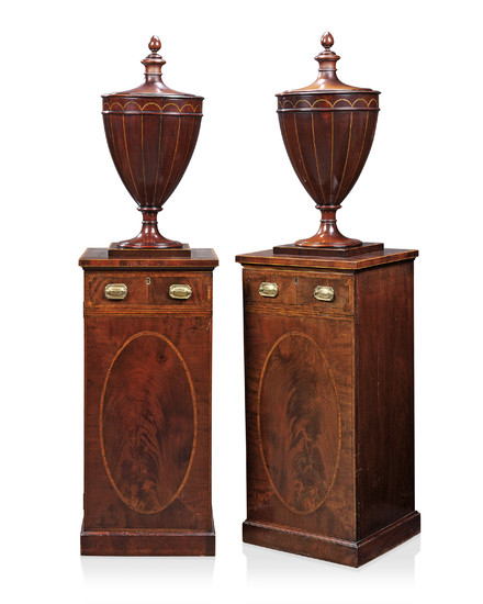 A PAIR OF DINING-ROOM PEDESTALS, GEORGE III, CIRCA 1790, THE URNS ASSOCIATED, ONE OF LATER DATE AND MADE TO MATCH