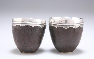A PAIR OF LATE 18TH/EARLY 19TH CENTURY MOUNTED COCONUT CUPS