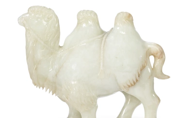 A PALE GREENISH-WHITE JADE FIGURE OF A STRIDING CAMEL CHINA