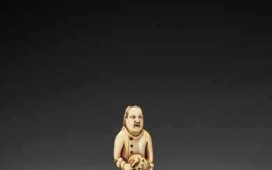 A RARE IVORY NETSUKE OF A DUTCH CHILD PLAYING THE DRUM