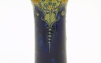 A Royal Doulton vase with stylised Art Nouveau flowers