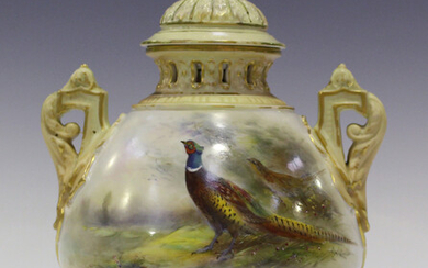 A Royal Worcester porcelain potpourri vase, liner and cover, circa 1910, the bulbous body painted by