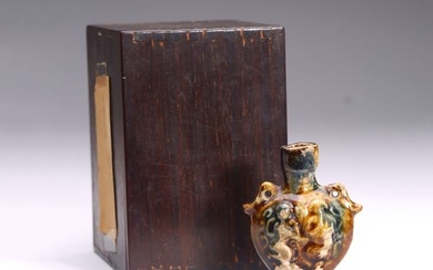 A SMALL CHINESE SANCAI GLAZED MOULDED JAR