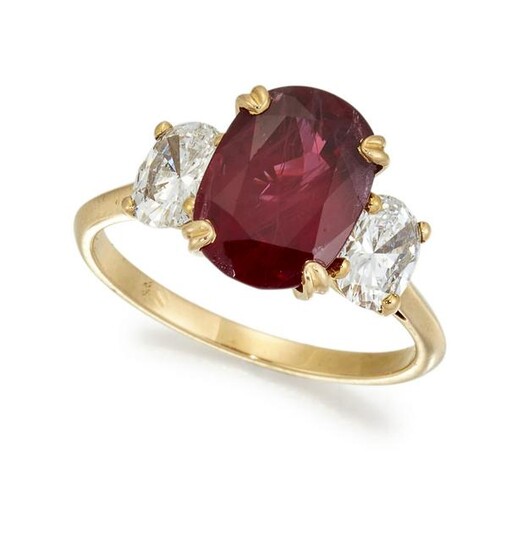 A THREE STONE RUBY AND DIAMOND RING, the oval ruby