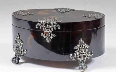 A Tortoiseshell and Silvery Metal Mounted Oval Box, the...
