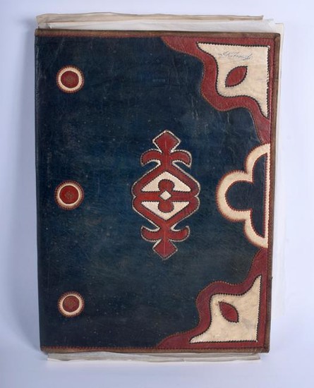 A VINTAGE TOOLED LEATHER FOLIO containing two