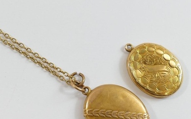 A Victorian oval locket with laurel leaf band decoration, wi...