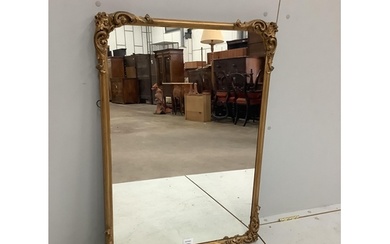 A Victorian style gilt and composition rectangular wall mirr...