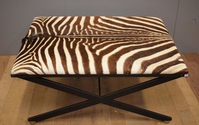 A ZEBRA SKIN STYLE (STAINED COW HIDE) COVERED GALLERY SEAT