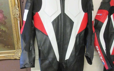 A black, red and white leather motorcycle suit by SaramotoCondition...