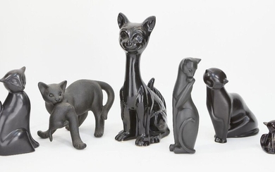 A collection of black glazed pottery cats, largest 30.5cm high, smallest 7.5cm (6)