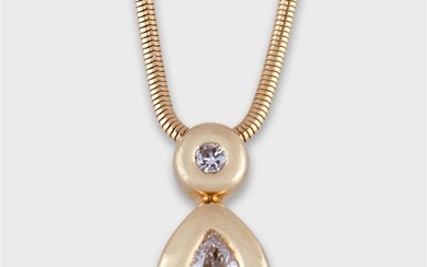 A diamond and fourteen karat gold pendant necklace designed...