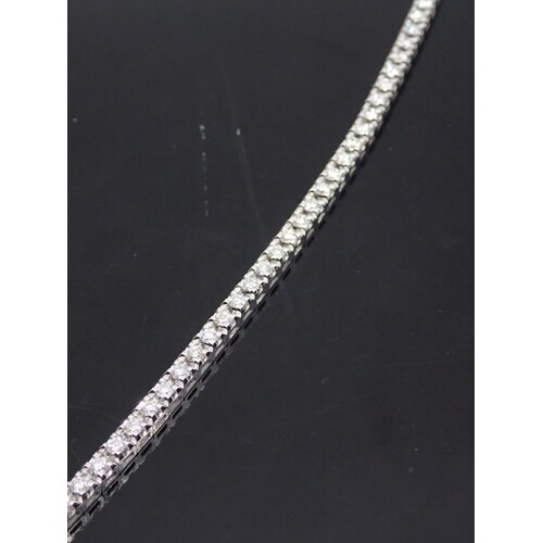 A diamond line/tennis bracelet with a HRD certificate which ...