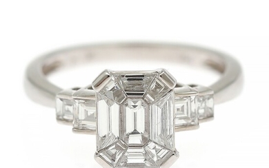 A diamond ring set with a fancy-cut diamond encircled by numerous trapez and square-cut diamonds weighing a total of app. 1.39 ct., mounted in 18k white gold.