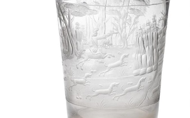 A large 18th century Bohemian glass beaker of tapering form, richly engraved with a hunting scene, huntsmen and hounds chasing a buck in the woods, a castle on a cliff side shown in the background. H. 17 cm. Diam. 13.5 cm.