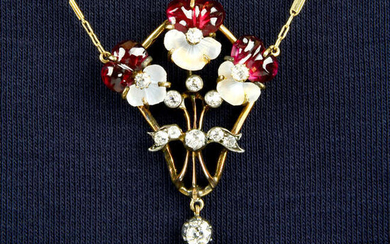 A late 19th century carved moonstone and garnet pansy pendant, with old-cut diamond highlights, on brilliant-cut diamond accent chain.
