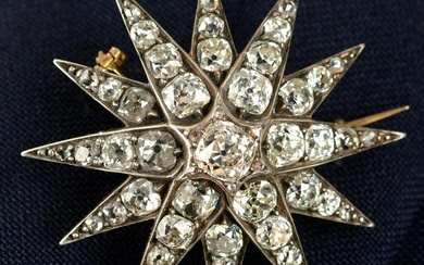 A late Victorian silver and gold old-cut diamond star brooch.May be worn as a pendant.Estimated