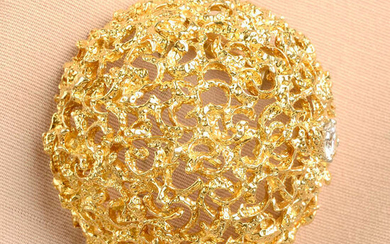 A mid 20th century textured dome brooch, with brilliant-cut diamond highlight, by Van Cleef & Arpels.